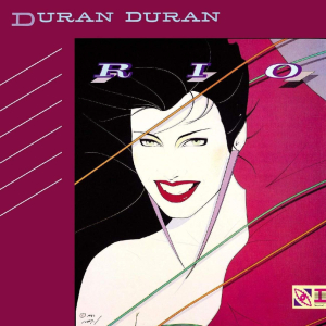 A white-skinned girl with a large smile and black hair, surrounded by a purple border. The words Duran Duran and RIO appear.