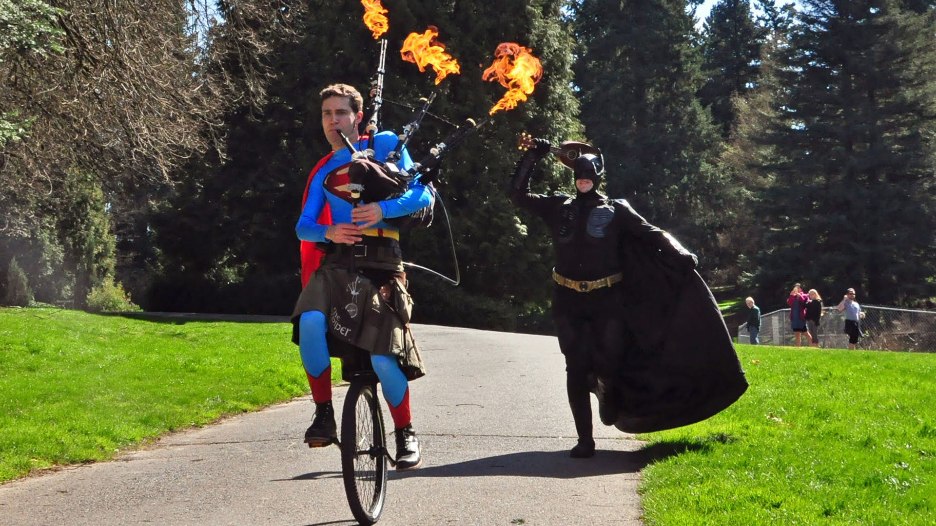 Batman Upstaged By Unicycling Superman Playing Flaming Bagpipes — GeekTyrant