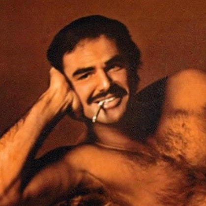 What Burt Reynolds and His Bearskin Rug Can Teach You About Shirtless  Selfies | GQ