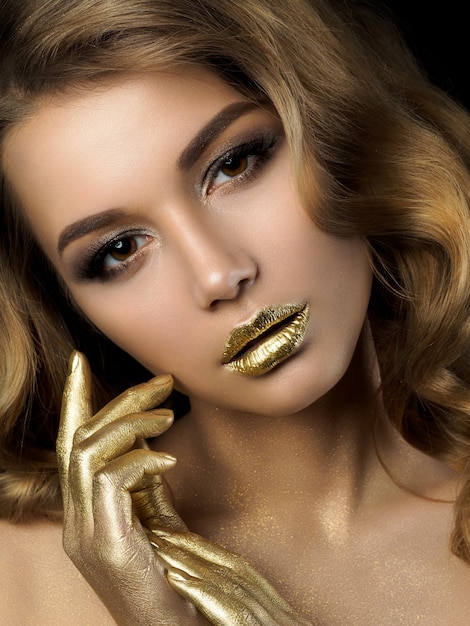 beauty-portrait-young-woman-with-golden-makeup_254969-2054.jpg