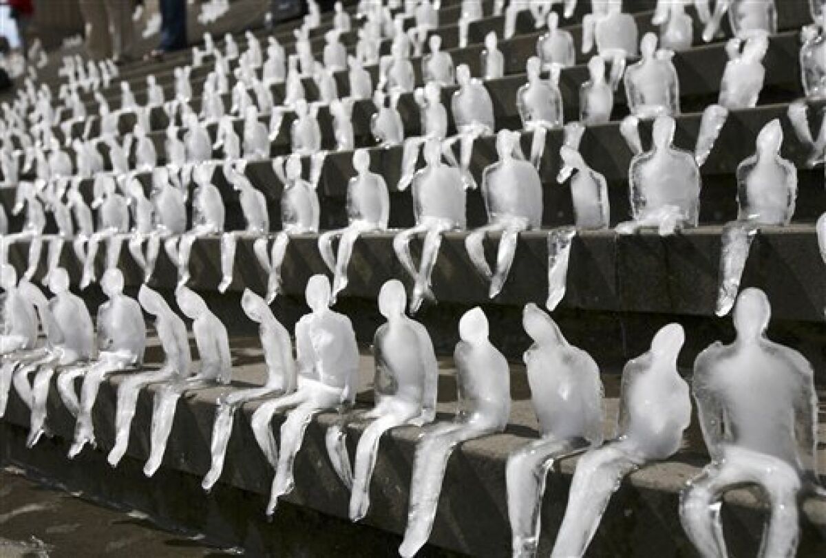 Climate spotlight: 1,000 ice men melt in Berlin - The San Diego  Union-Tribune