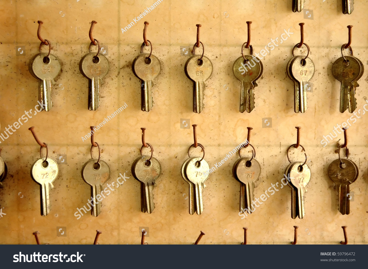 stock-photo-old-keys-hang-on-wood-board-59796472.jpg